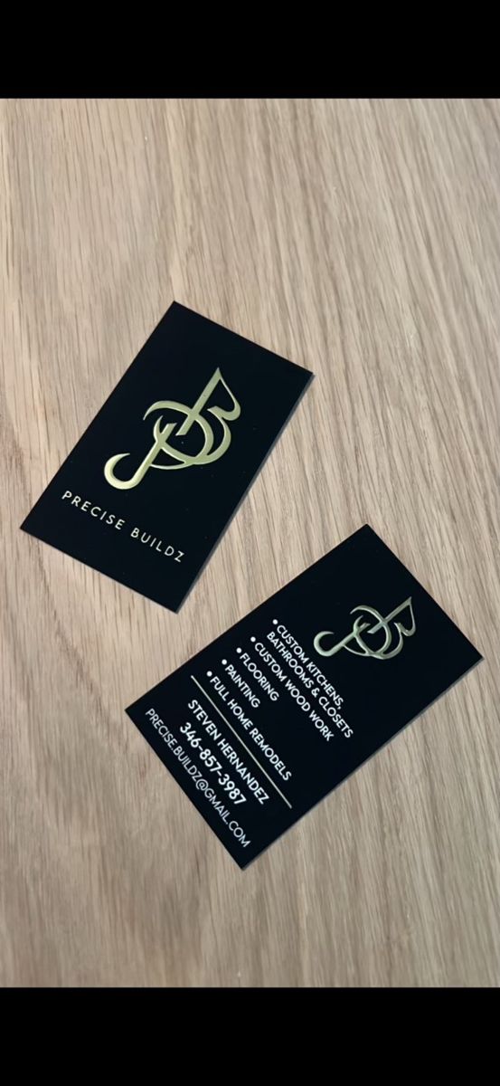 Precise Buildz business cards showing the logo and service list