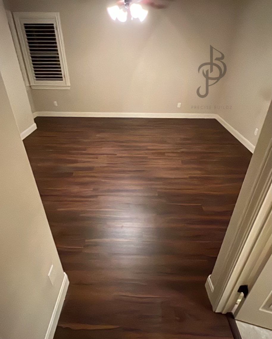 Finished room with painted walls, white chair-rail trim, and baseboards