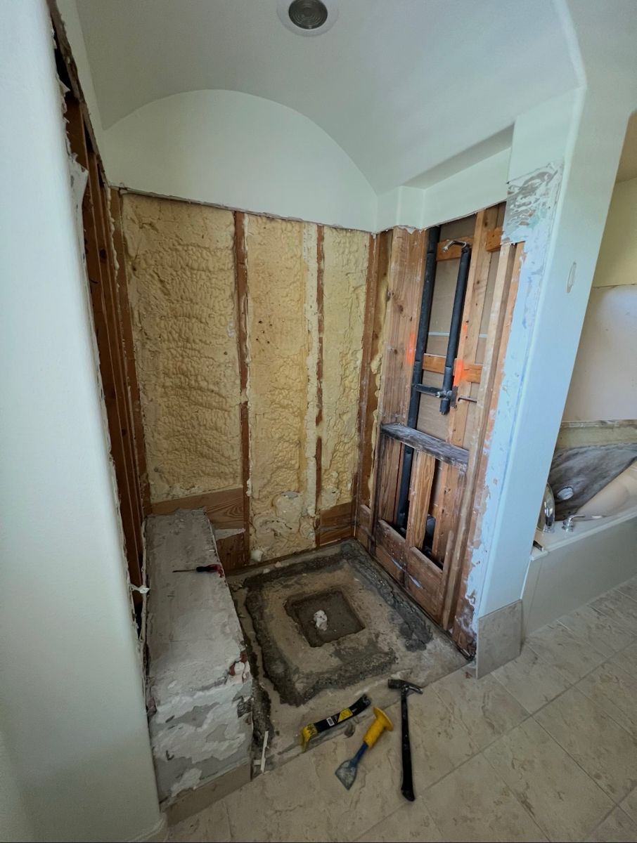 The same shower alcove taken down to the studs during renovation
