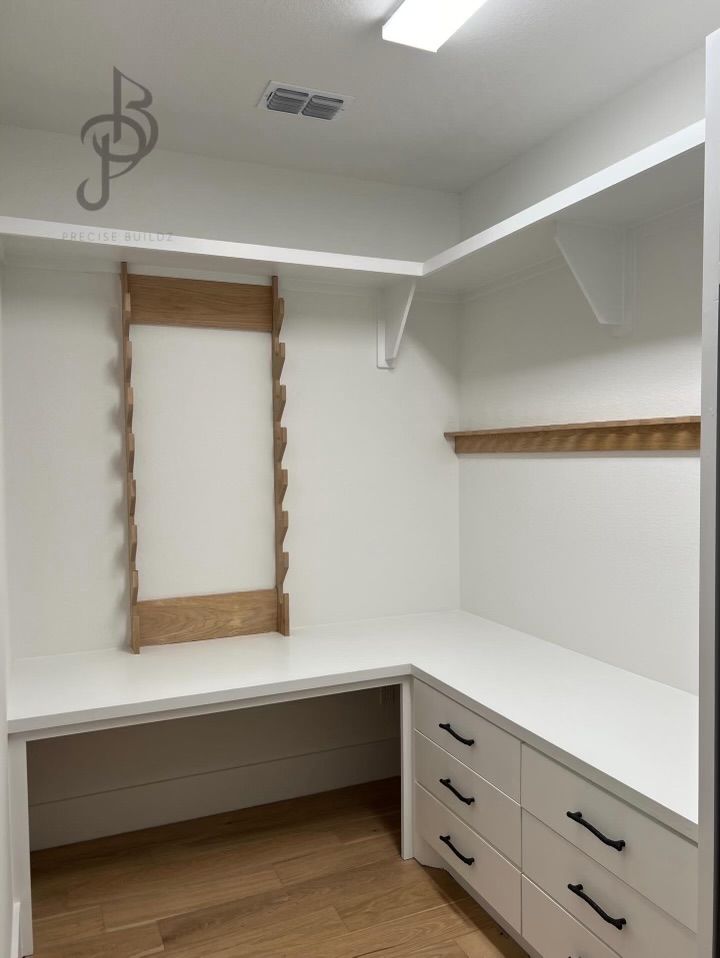 Bespoke storage cabinetry, white drawers, and custom woodwork