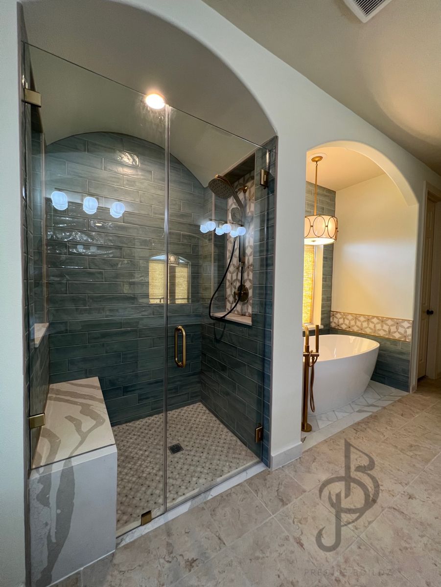 Luxury master bathroom remodel with glass shower and tub