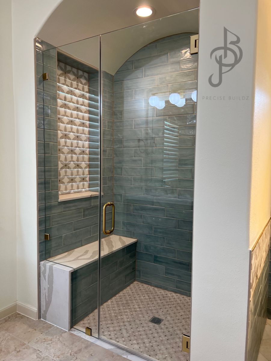 Waterproof master shower with custom glass enclosures and black hardware trim