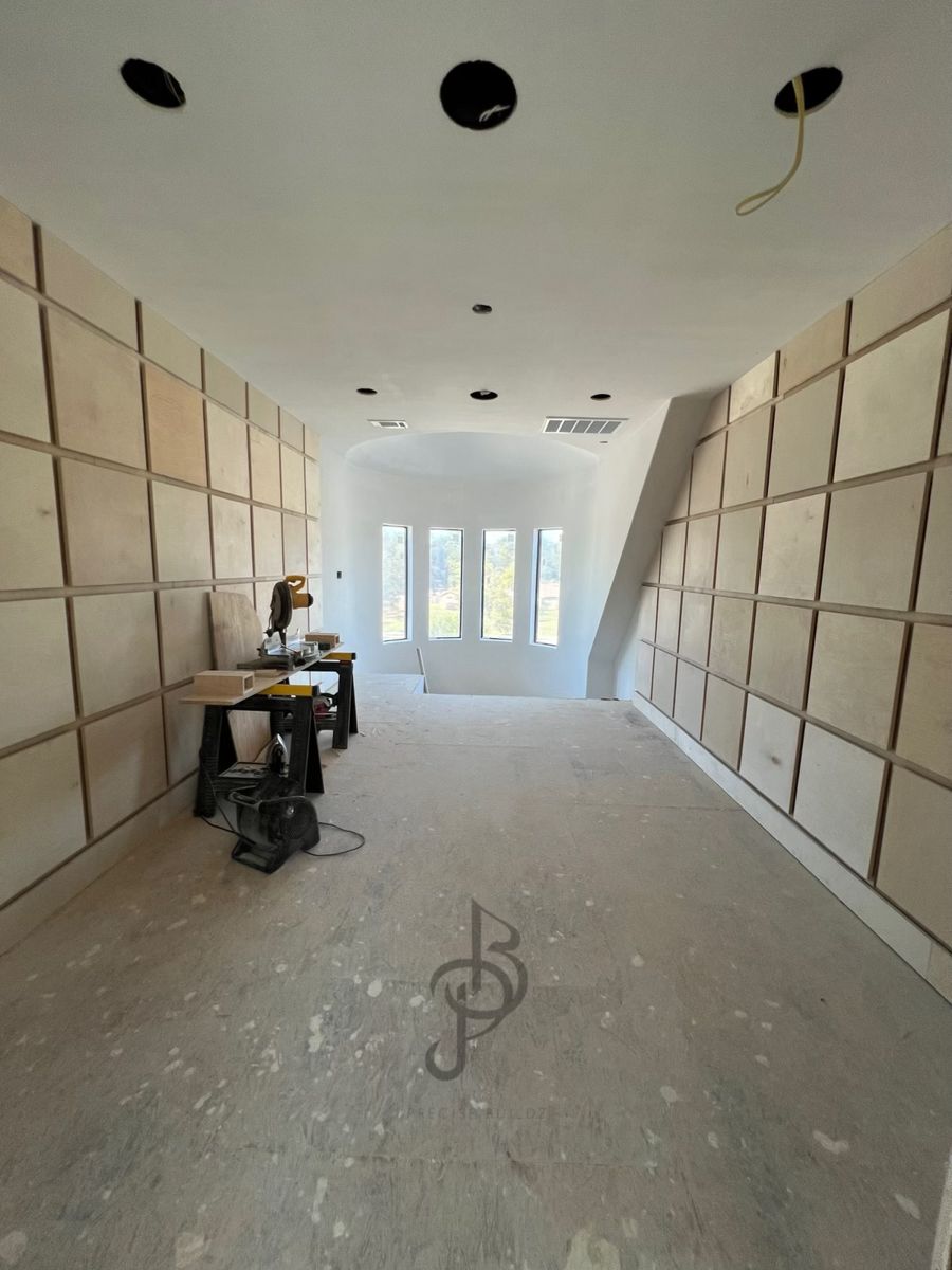 Custom wood paneling construction under Steven Hernandez's direct supervision